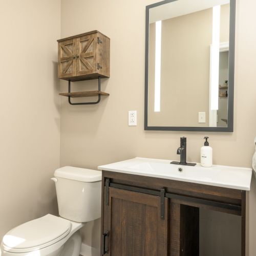 Conveniently located right near the front door, this half bath adds extra comfort for guests on the go.