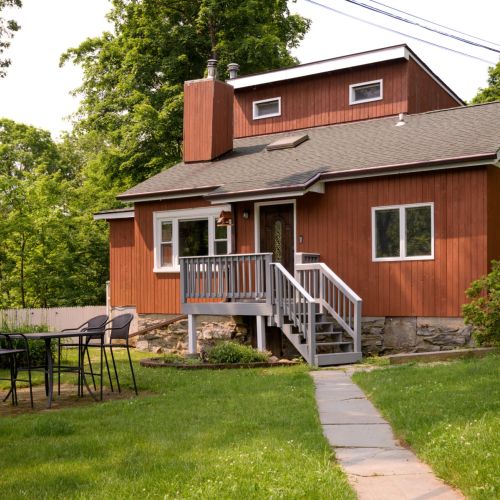 Unwind on the front patio with a 4-seat dining set and Weber charcoal grill - perfect for slow mornings, al fresco dinners, or summer night s’mores under the stars.