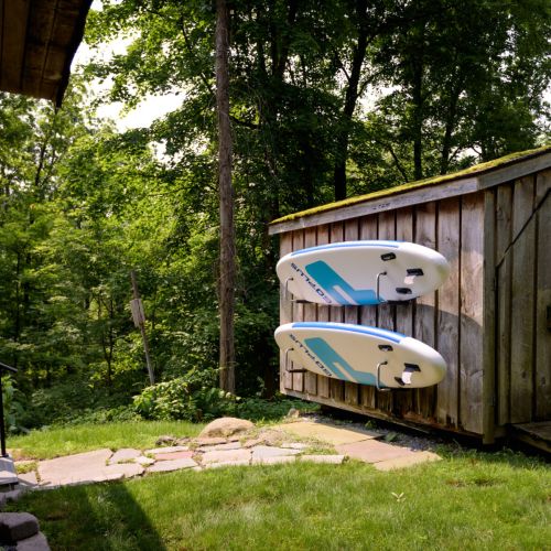 Follow the stone path to our backyard shed - where you’ll find paddleboards tucked along the side, ready for a day on the water. Paddleboards are available from Memorial Day to Labor Day.