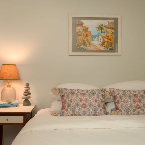 Located on the main floor, this inviting queen bedroom offers a peaceful place to recharge after a day of exploring.