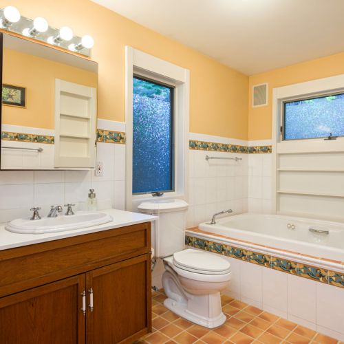 Bright and functional, this full bath offers a spacious tub — perfect for a post-lake soak or easy bath time with little ones.