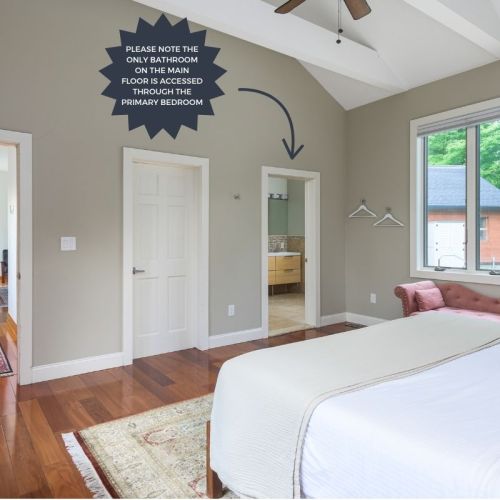 This king bedroom features direct access to the main floor’s only bathroom.