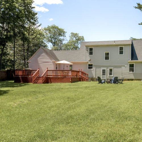 The spacious fully fenced-in backyard offers plenty of open space for kids to play or pups to explore.