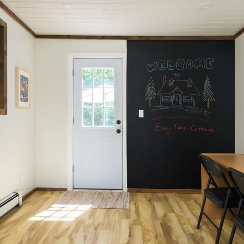 This oversized chalkboard wall sets the tone for creativity, whether you're sketching a masterpiece or leaving a note for the next guest.