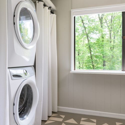 Even chores feel serene with woodland views from the laundry room.
