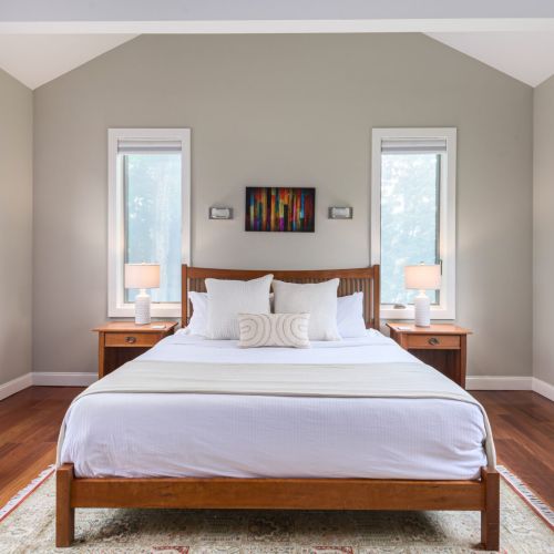 With its spacious layout and calming view, the primary bedroom invites you to slow down and soak it all in.