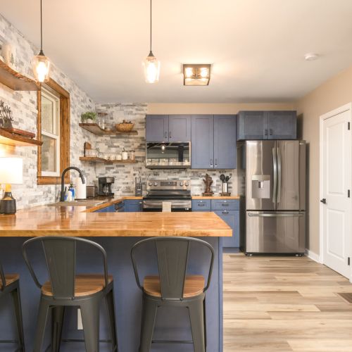 With an open layout and island seating, the kitchen is perfect for morning chats, shared cooking, and staying part of the action.