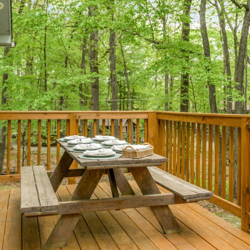 Dine al fresco with lake breezes - the spacious deck are perfect for casual meals and summer sunsets. Please note the picnic table has been moved down near the lake.