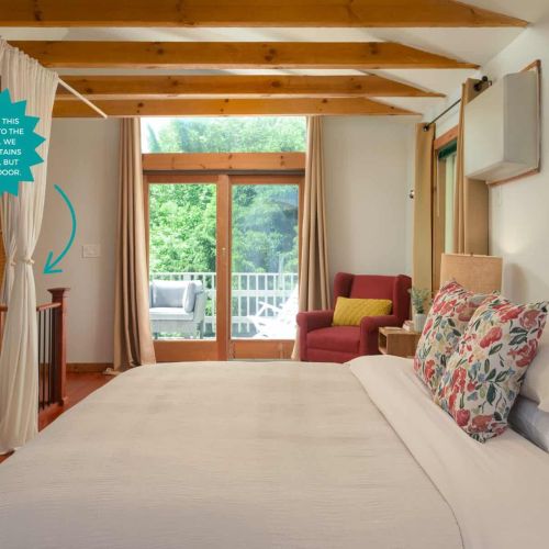 Perched above the main living area, the loft suite features a king bed, private balcony access, and curtains for added privacy. Please note this loft is open to the first floor. We provide curtains for privacy, but there is no door.