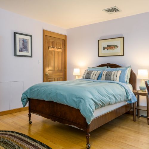 A restful space with a breath of fresh air — this bedroom features a full bed and a private door leading straight to the outdoors.