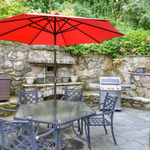 Fire up the grill, pour a drink, and settle in—this shaded patio was made for long lunches and golden hour dinners.