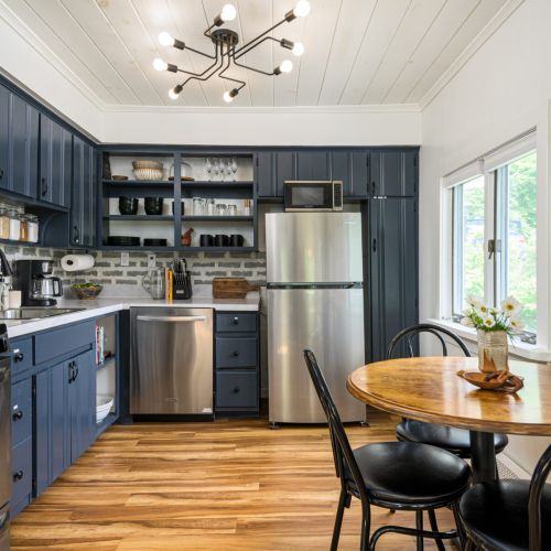 Whip up something simple or special in this light-filled kitchen, stocked with essentials and cozy seating for four (additional 4th chair available)