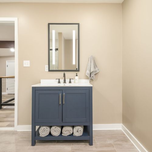 Freshen up with ease - this upstairs bath features a sleek walk-in shower and simple, modern touches.