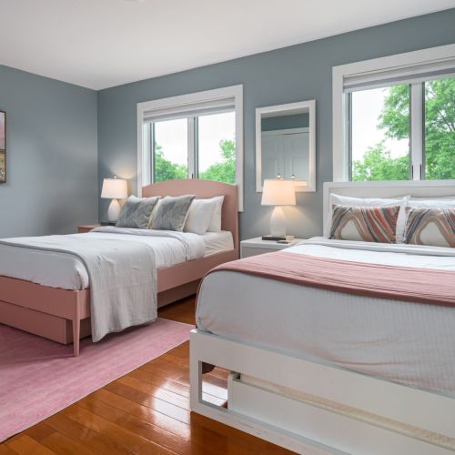 With two comfy full beds and ample closet space, this room is ideal for families, friends, or a cozy night in with extra elbow room.