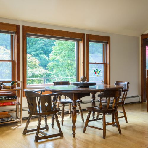 Game night with a view — this sunlit corner is perfect for cards, puzzles, or friendly competition after a day on the water.