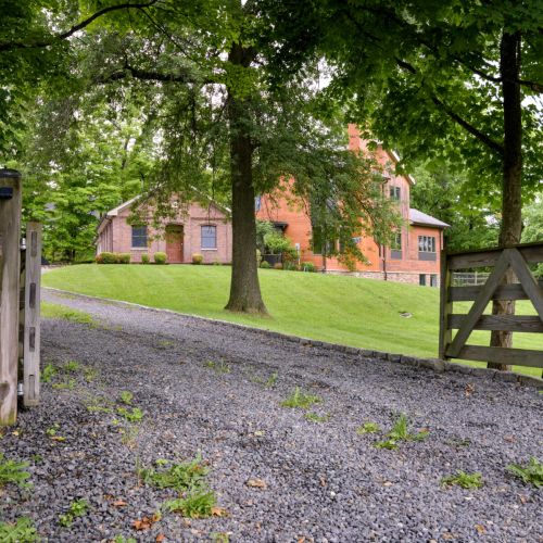 Step through the wooden gate and into your getaway - where charm, comfort, and calm begin at the front path.