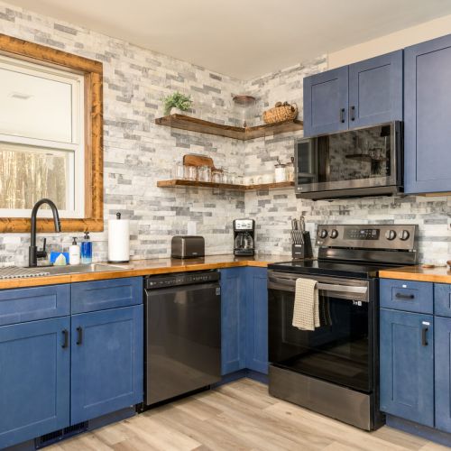 Start your day at the coffee bar - drip brewer, electric kettle, and lake views included.