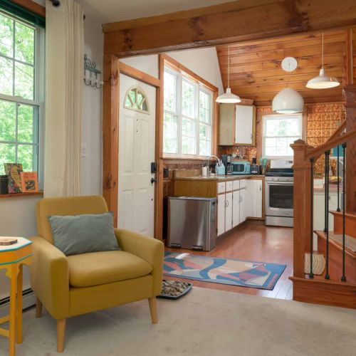 Bright windows, warm wood details, and an open layout create an inviting space to settle in.