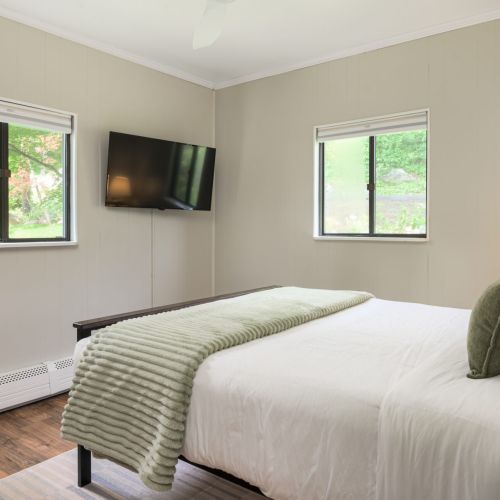 Whether you're streaming your favorite show on the 40inch smart TV or winding down with a book, this queen bedroom offers both comfort and quiet with thoughtful light control.