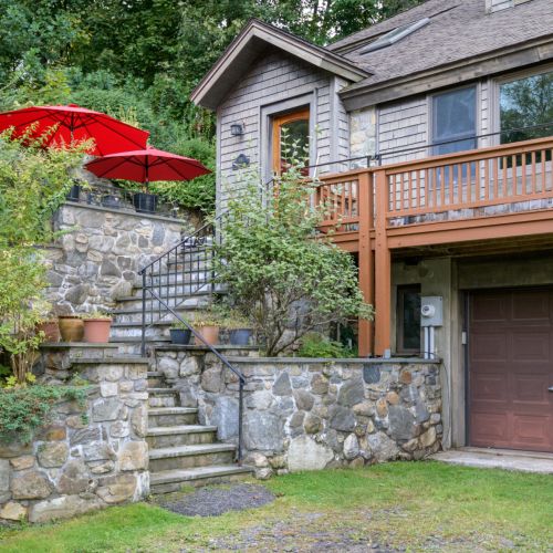Follow the stone path to the front door and step into your serene lakeside retreat.