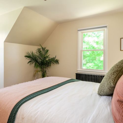 This upstairs retreat blends simple comforts with natural light, offering a peaceful space to recharge after a day exploring the Hudson Valley.