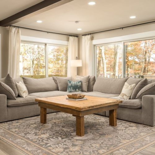 Stretch out and get cozy - our oversized sectional is made for movie nights, board games, or lakeside lounging with wraparound window views.