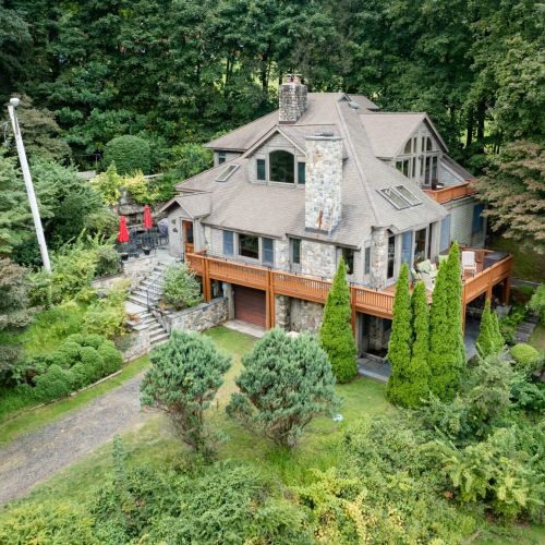 From the moment you pull into the driveway, you’re greeted with wraparound decks, shaded porches, and plenty of spots to sip, sit, and stay awhile.