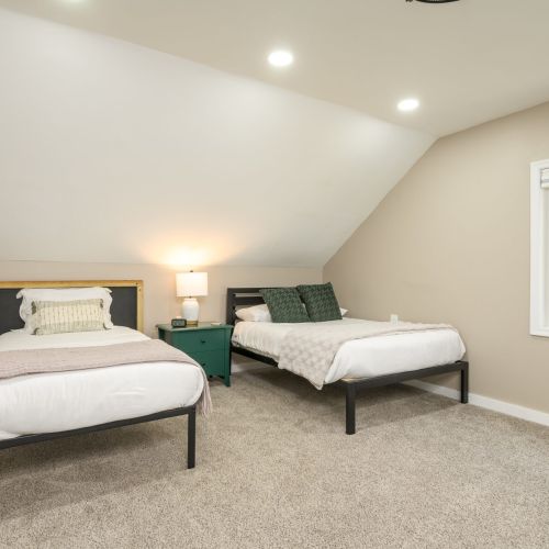 Perfect for families or friends - this cheerful upstairs bedroom features a full and twin bed, cozy accents, and plenty of space to unwind.