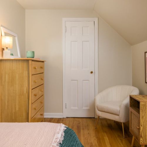 The cozy corner chair is just right for morning coffee or a good book under the reading lamp - your own little nook for unwinding.