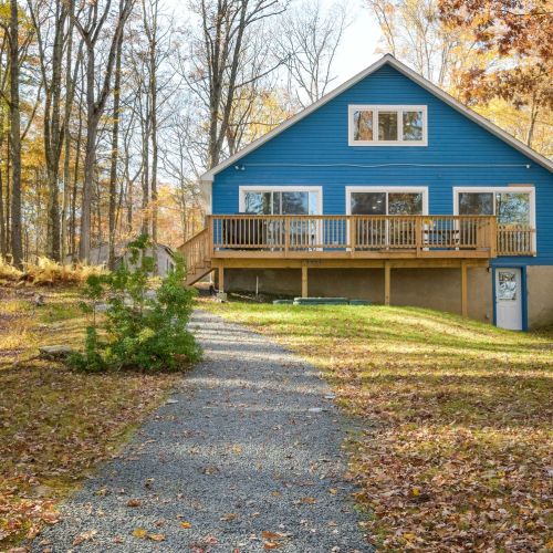 After exiting the back of the house it's just a short walk down the gravel path to the firepit, dock and beautiful Lake Teedyuskung.