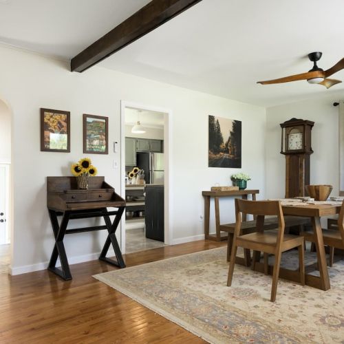 A wide view reveals the thoughtful layout - with the staircase, kitchen, and living room all connected for easy, open living.