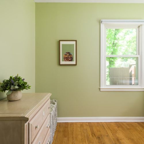 Equipped with blackout shades, a full dresser, and easy access to the main living space and full bathroom.