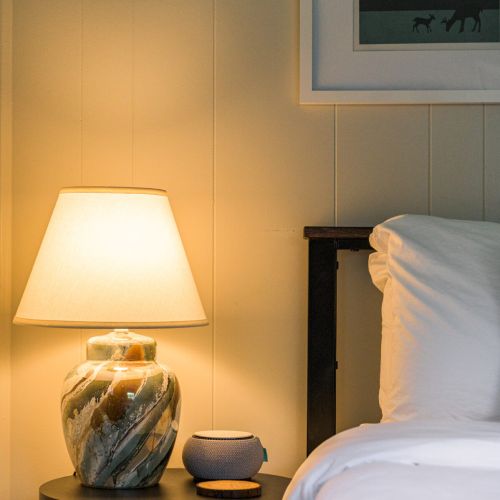 Each bedroom is thoughtfully stocked with a soft-glow lamp and a white noise machine - because restful sleep is all in the details.